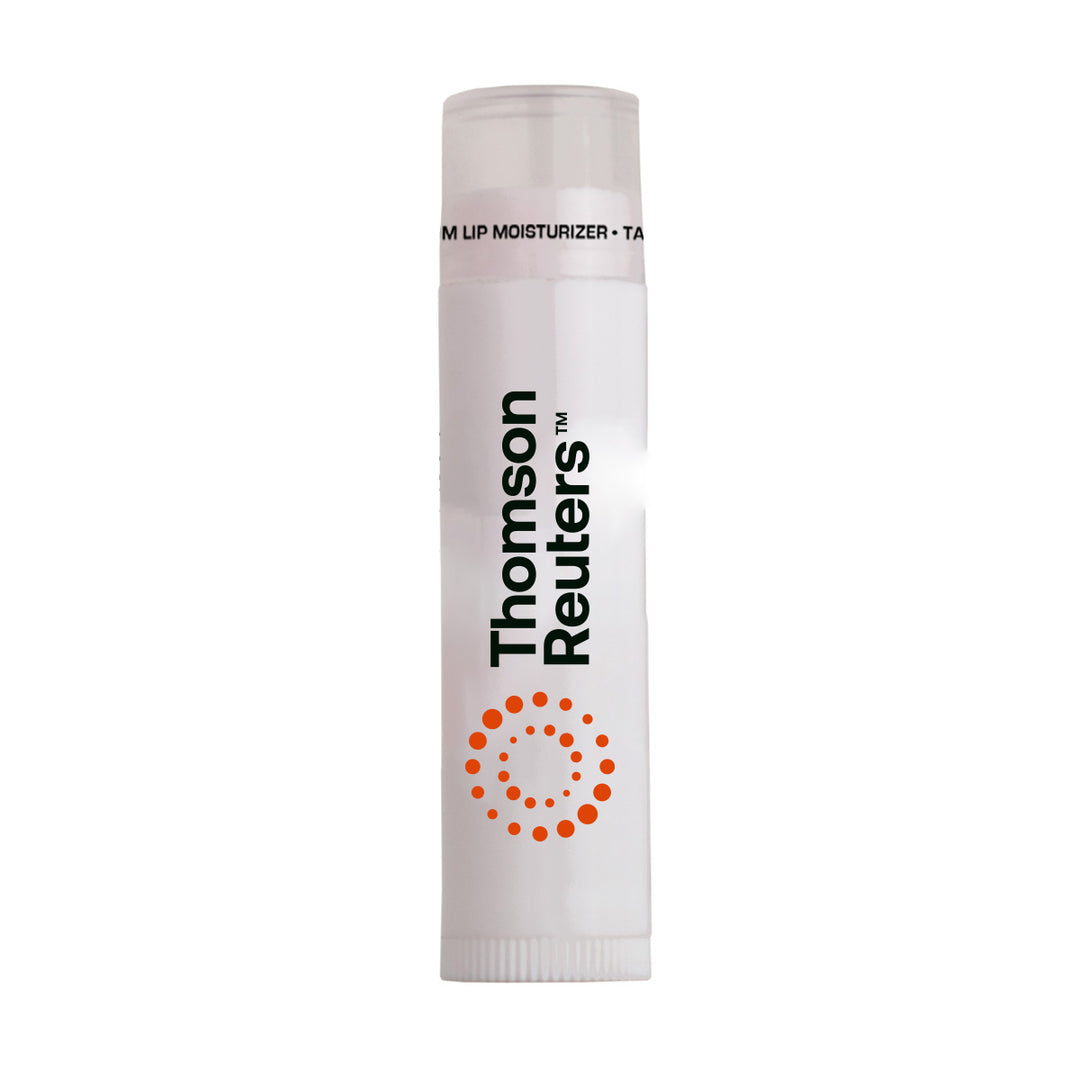 A white tube of Thompson Reuters lip moisturizer with black text and an orange circular dot pattern, shown on a plain white background. Clear Cap