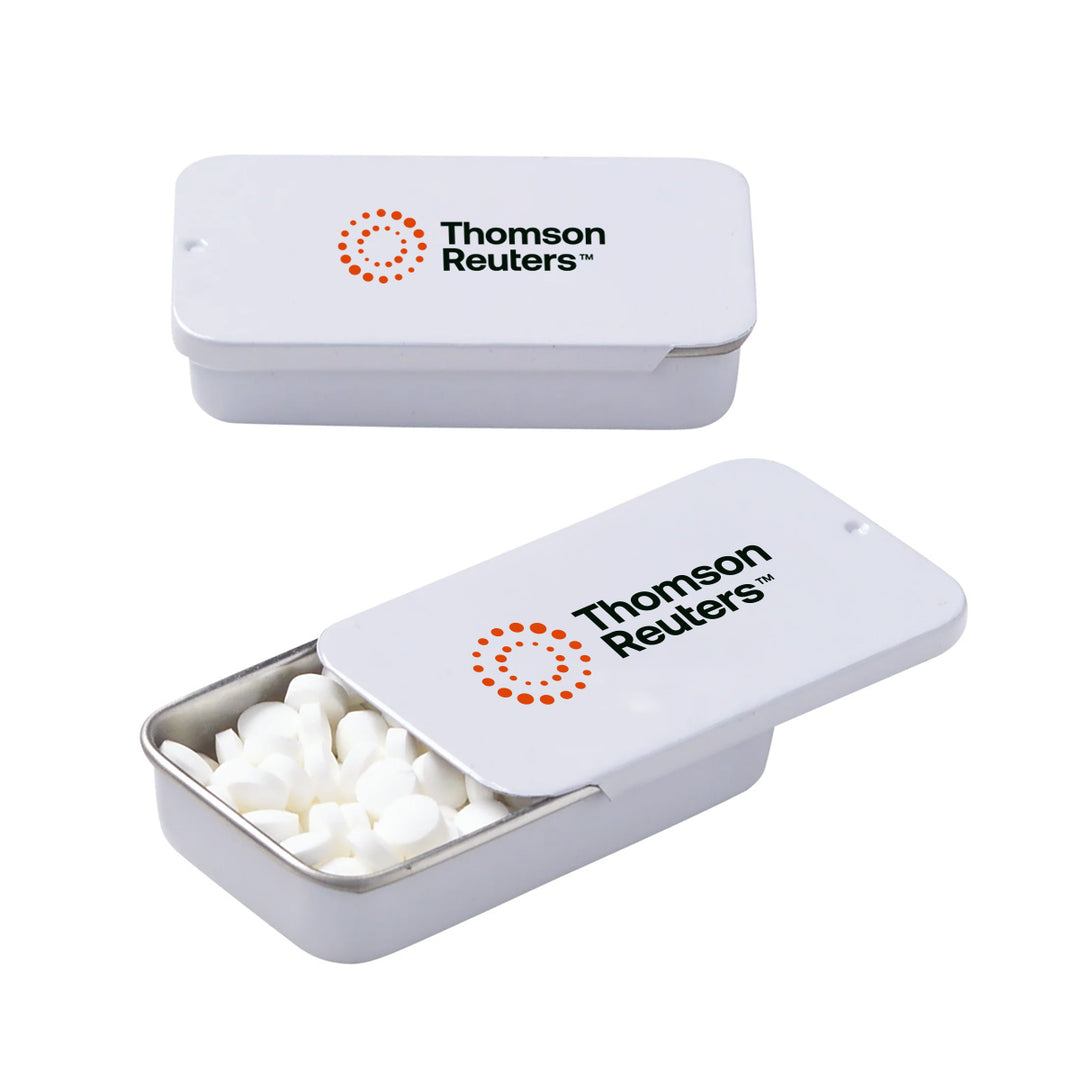 Two white rectangular metal tins with rounded corners, shown on a light gray background. The top tin is closed with the Thomson Reuters logo printed on the lid.